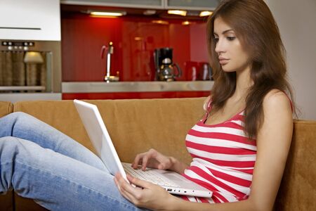 beautiful young adult woman writing on notebookの写真素材