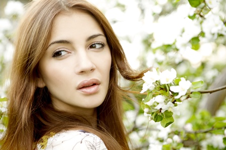 beautiful brunette in the gardenの写真素材