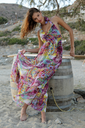 beautiful brunette woman in romantic summer dress, outdoor shotの写真素材