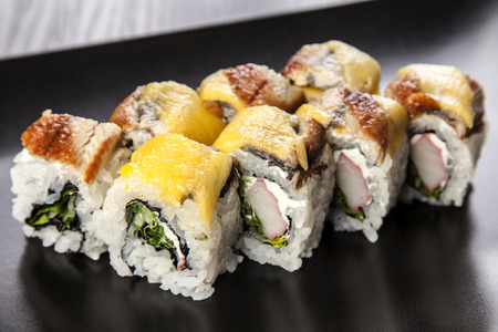 Sushi Maki roll assortment on black dishの写真素材