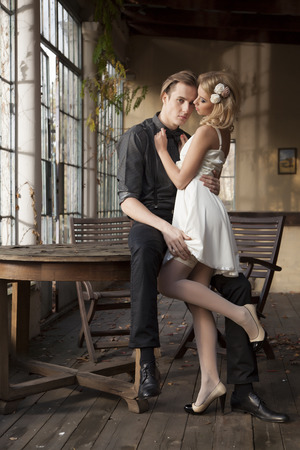 Portrait of young adult couple in love posing in classic elegance clothes to dateの写真素材