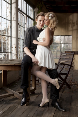 Portrait of young adult couple in love posing in classic elegance clothes to dateの写真素材