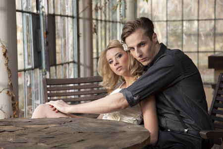 Portrait of young adult couple in love posing in classic elegance clothes to dateの写真素材
