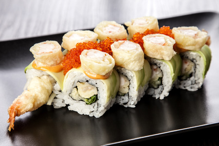 Sushi Maki roll assortment on black dishの写真素材