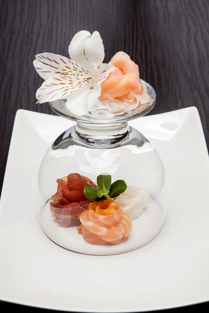 Sushi Maki roll assortment on black dishの写真素材