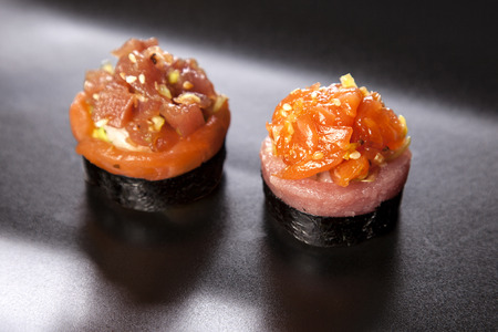 Sushi Maki roll assortment on black dishの写真素材