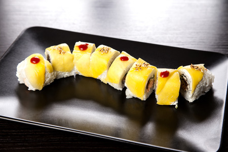 Sushi Maki roll assortment on black dishの写真素材