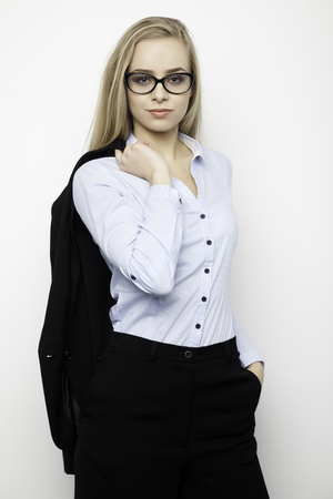 Silhouette of a beautiful young adult slim sexy and attractive sensuality pretty blonde woman in elegance fashionable dressの写真素材