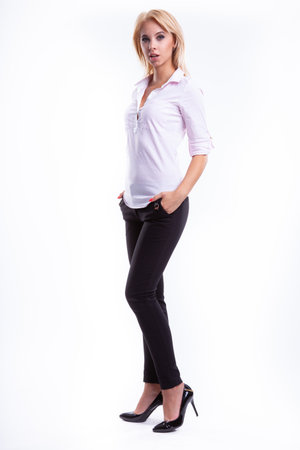figure of a young attractive blonde woman in casual dress code isolated on white backgroundの写真素材