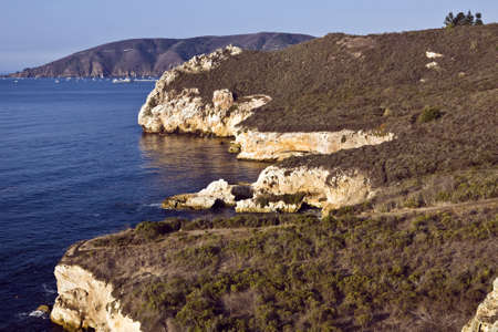 Cliffs rise abruptly from the ocean near Avila Beach, Californiaの写真素材
