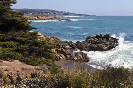 Surf crashes against the rugged shoreline at the north end of Moonstone Beach in Cambria,...