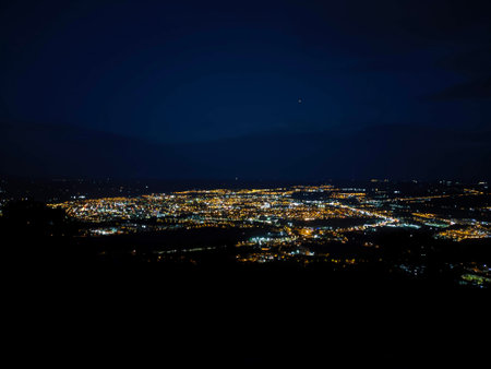 Night view of the city from the top of the mountain in the eveningの写真素材
