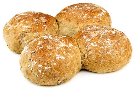 four buns with a bit of flour on them placed on a white tableの写真素材