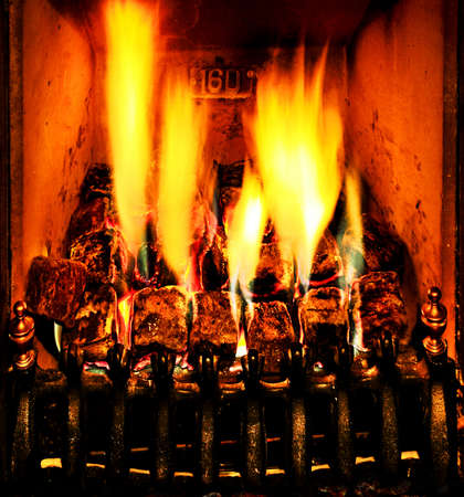 Blazing flames of a fireplace in an old house