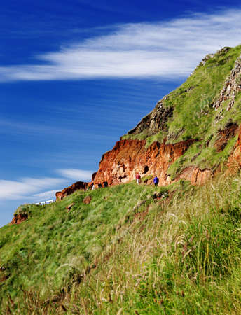 A red volcanic rocks over the famous Giant s Causeway of Northern Ireland の写真素材