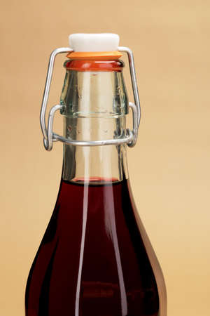 A close-up picture of a home made red wine in a classic bottleの写真素材