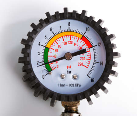 A compressor pressure gauge on a white backgroundの写真素材