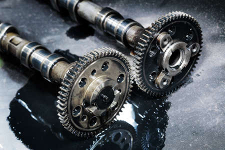 cam shaft of a turbo diesel engine on a dark backgroundの写真素材