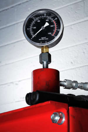 Black manometer on a red pressの写真素材