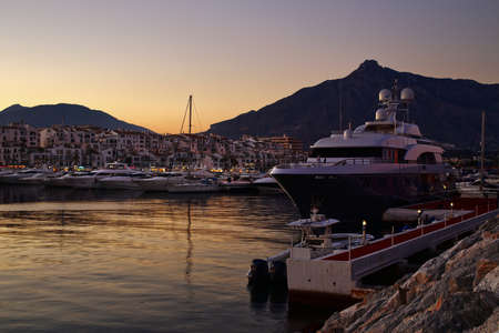 Luxury yachts and motor boats moored in Puerto Banus marina in Marbella, Spain 