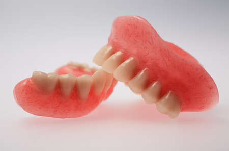 A set of dentures on a gray backgroundの写真素材