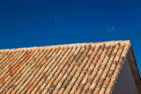 Traditional Spanish antique roofing tiles. These brown-orange tiles are characteristic of the vibrant Spanish architecture.の写真素材