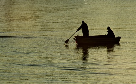 Two Men Row Ashoreの写真素材