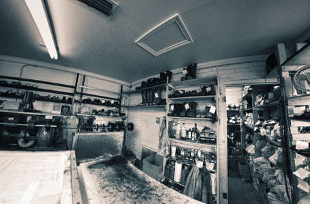 Shoe-repair store photo in black and whiteの写真素材