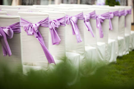 Close up of decorated wedding chairの写真素材