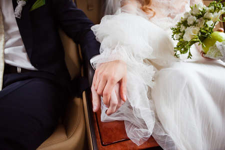 the bride and groom go to the wedding car tripの写真素材