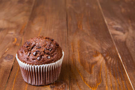 muffin chocolate  on dark wood tableの写真素材