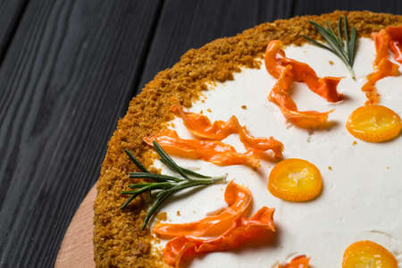 homemade vegan carrot cake on a wooden plateの写真素材