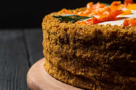 homemade vegan carrot cake on a wooden plateの写真素材