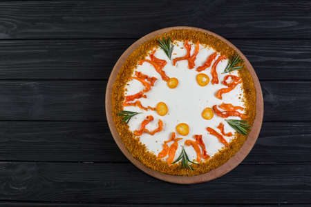 homemade vegan carrot cake on a wooden plateの写真素材