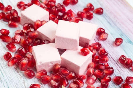 pink marshmallow handmade and pomegranate on the table