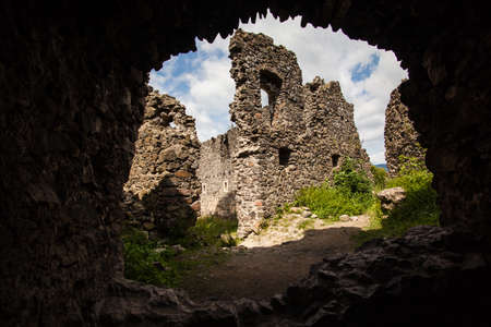 Ruins of Castle Nevytske near of Transcarpathian region center, Uzhgorod photo. Nevitsky Castle ruins built in 13th century. Ukraine.の写真素材