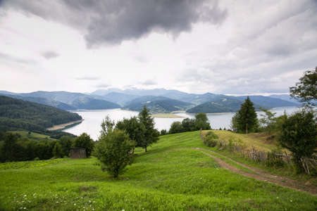 Cloudy landscape view from Lake Bicaz in Romaniaの写真素材