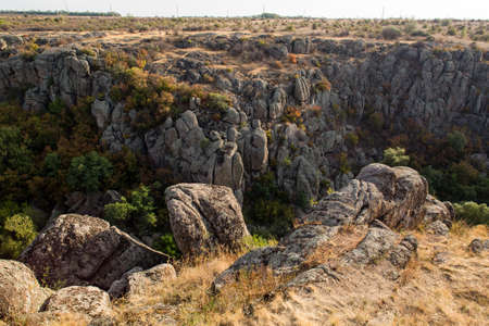 Rock canyon against beautiful sunset background/ Aktove Canyon near the Aktove village on the Mertvovid river, Voznesenskyi region, Mykolaiv Oblast, Ukraineの写真素材