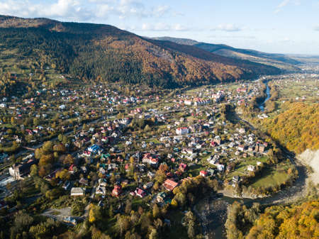 Aerial autumn top view of the Carpathian village at sunny day, Ukraineの写真素材