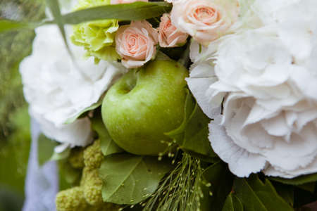 Beautiful wedding floral decoration with green appleの写真素材