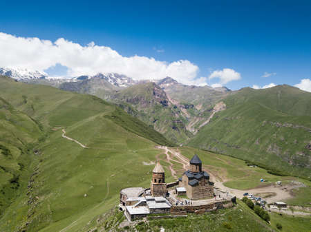 Aerial view to Gergeti Trinity Church or Tsminda Sameba, Holy Trinity Church near the village of Gergeti in Georgia, under Mount Kazbegi, Georgiaのeditorial素材