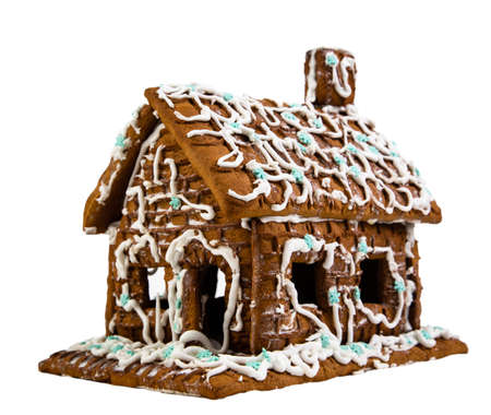 Homemade gingerbread christmas house isolated on white