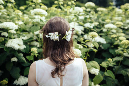 Bride with flowers in her hair in the garden