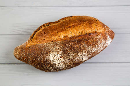 Rye bread ciabatta on a gray wooden background