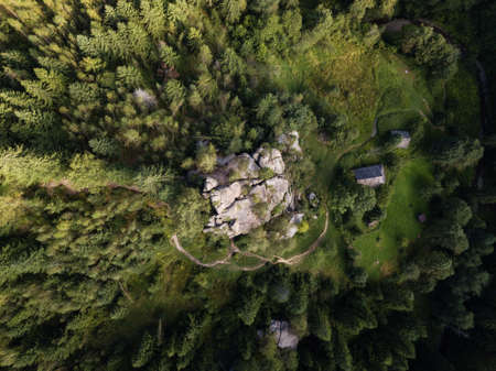 Aerial top view stone rocks Ternoshorska Lada amidst beautiful scenic Carpathian mountains and forest. Symbol of motherhood and fertility, Kosiv Region, Ivano-Frankivsk Oblast, Ukraineの写真素材