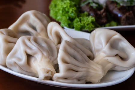 Georgian traditional Khinkali with meat on white plateの写真素材