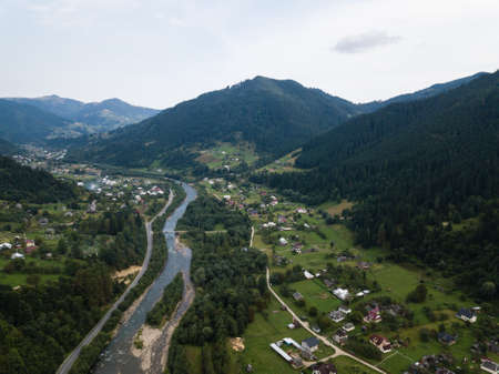 Famous green tourism village Kryvorivnia in Carpathians mountains at summer, typical landscape in Hutsulshchyna National Park in Ukraine. Vacation and outdoor sports.の写真素材