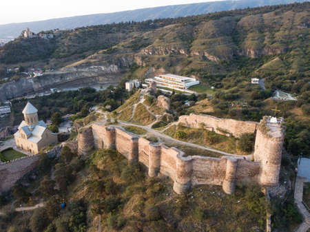 Aerial view to Saint Nicholas church in Narikala fortress and beautiful panoramic view of Tbilisi at...