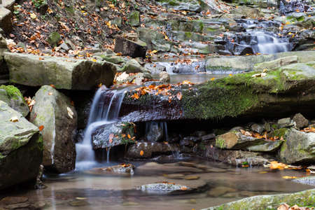 Autumn waterfall in the Carpathian mountains, Ukraine