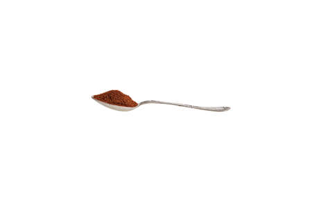 Old silver spoon with ground coffee on a white background, low angle viewの写真素材